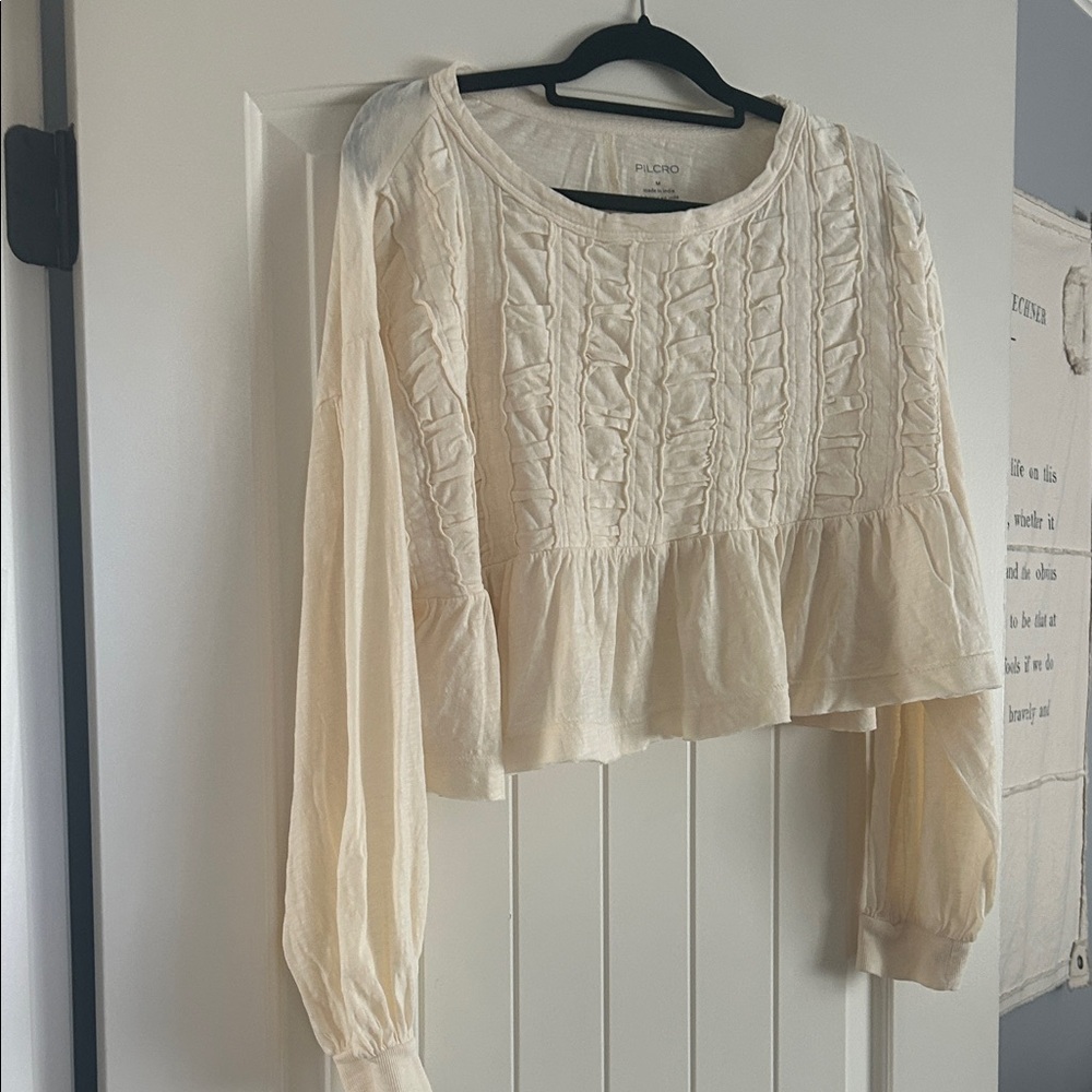 Anthro Pilcro Cream Ruffled Blouse size M.